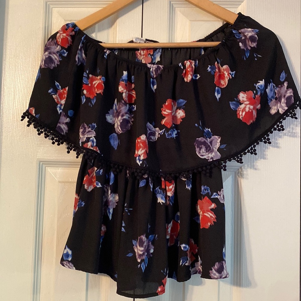 Off the shoulder blouse style shirt. Red and purple flower pattern.